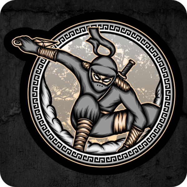 Die-cut vinyl sticker featuring a crouching ninja in grayscale gear with gold accents, framed by a circular Greco-style border, displayed on a dark concrete-textured background.